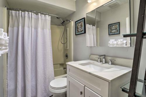 a white bathroom with a sink and a toilet at South Philly Townhome 3 Mi to Center City in Philadelphia