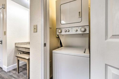 a washer and dryer with a microwave above it at Floridays Resort Condo Less Than 4 Mi to Walt Disney! in Orlando