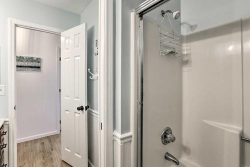 a bathroom with a shower and a mirror at All Decked Out Home on Cherry Lake with Dock! in Madison
