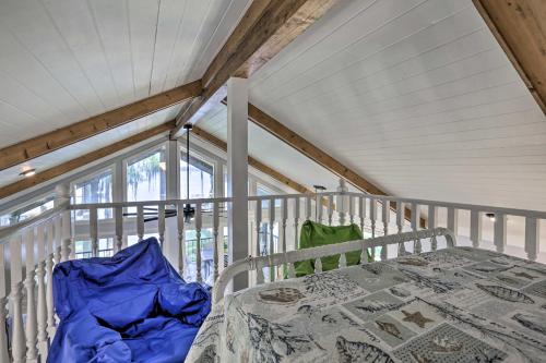 a white bed in a room with a window at All Decked Out Home on Cherry Lake with Dock! in Madison