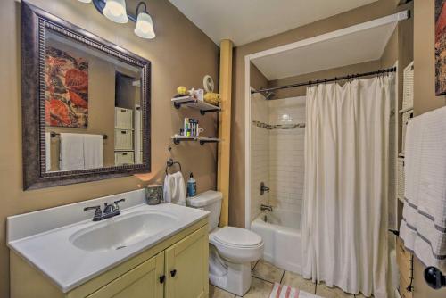 a bathroom with a sink and a toilet and a mirror at St Croix Falls Remote Retreat Pet Friendly! in Saint Croix Falls