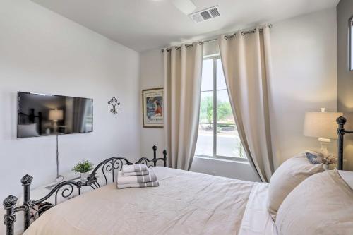 a white bedroom with a bed and a window at Resort Pool and Hot Tub 55 and Indio Desert Oasis in Indio