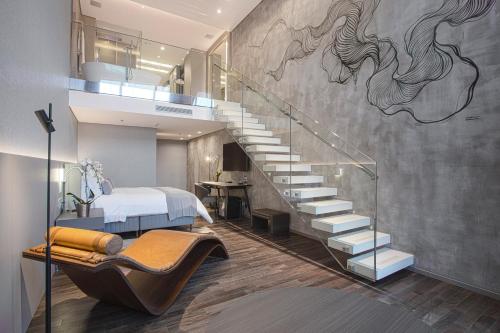 a bedroom with a staircase with a mural of horses on the wall at Suryaa Hotel Pinhais, Curio Collection by Hilton in Pinhais