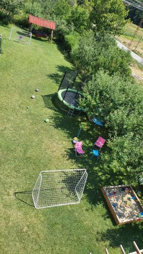 an aerial view of a park with play equipment on the grass at Hotel Zenit Satovcha in Satovcha