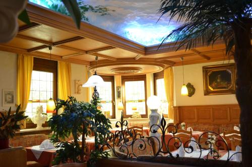 a dining room with a table and chairs at Hotel Royal in Villingen-Schwenningen
