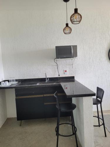Η κουζίνα ή μικρή κουζίνα στο Alto da Piraquara Flat