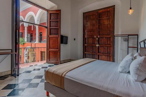 Postel nebo postele na pokoji v ubytování Hotel HO Merida