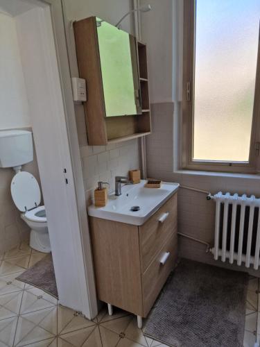 a bathroom with a sink and a toilet at FRANGI HOUSE in Pescara