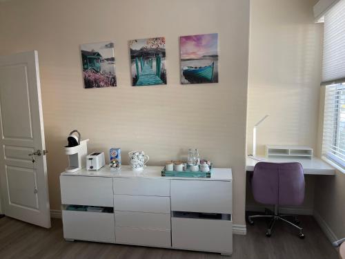 a room with a white desk and a purple chair at Resort Like Stay at a Cozy Relaxing Private Room Near UCI in Irvine