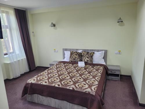 a bedroom with a large bed in a room at Villa Lotus in Deva