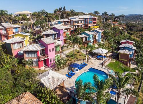 an aerial view of a resort with a swimming pool at Costa do Sol Boutique Hotel in Búzios