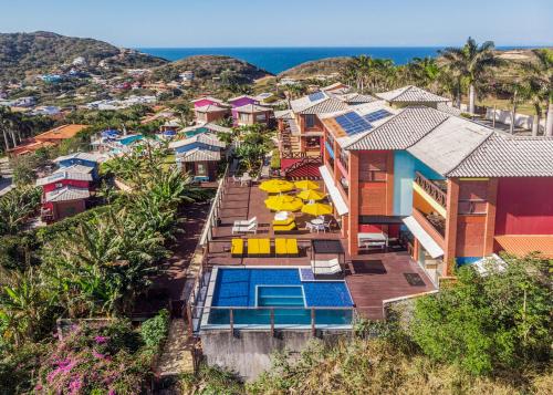 an aerial view of a house with a swimming pool at Costa do Sol Boutique Hotel in Búzios
