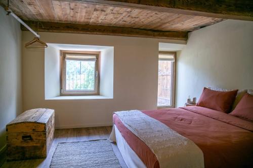 a bedroom with a large bed and a window at bnb Uja in Balme