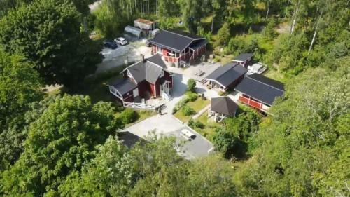 an aerial view of a house in the woods at Höga Backe Gästhus in Asphyttan