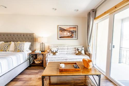 a bedroom with a bed and a table at Treasure Mountain Inn in Park City