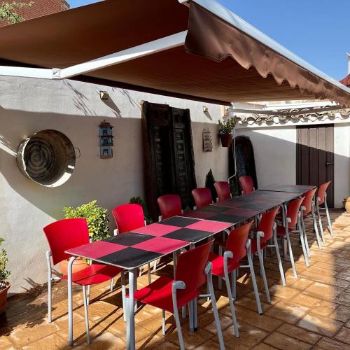 a table and chairs sitting on a patio at Casa El tio Daniel,,,,,,ahora con SPA in Bargas