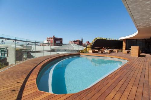 a swimming pool on the roof of a building at Wex 1 Apartments in Cape Town