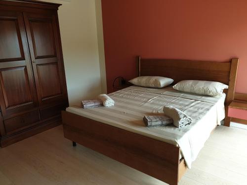 a bedroom with a large bed with two pillows on it at Ranch borgo bella vita in Cavalier