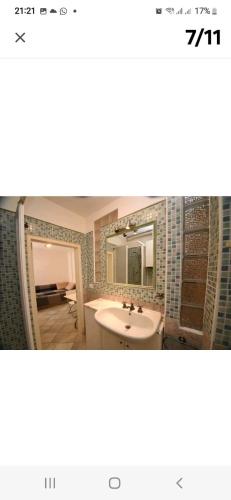 a bathroom with a sink and a mirror at da Antonio in Foligno