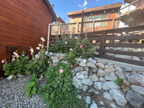a garden of flowers in front of a house at June Lake Villager in June Lake
