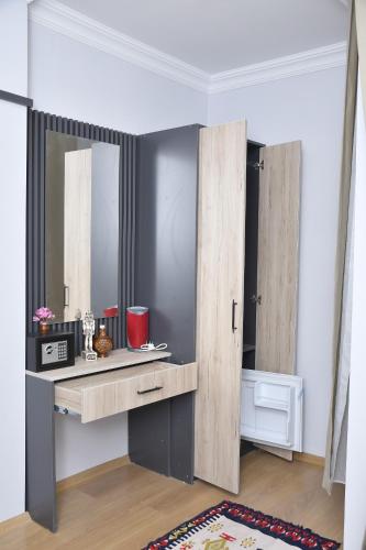 a dressing table with a mirror in a room at Hotel Arinna in Istanbul