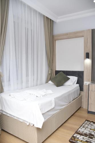 Postel nebo postele na pokoji v ubytování Hotel Arinna