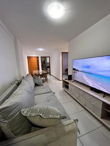 TV a/nebo společenská místnost v ubytování Apartamentos 250m da Orla -Edifício Nugali- Castelo B Temporada