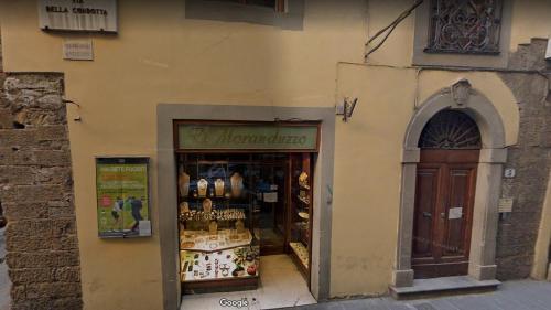 a store front of a building with a store window at Condotta3Rooms in Florence