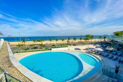 a view of a swimming pool and the beach at Hotel Nacional Rio De Janeiro in Rio de Janeiro