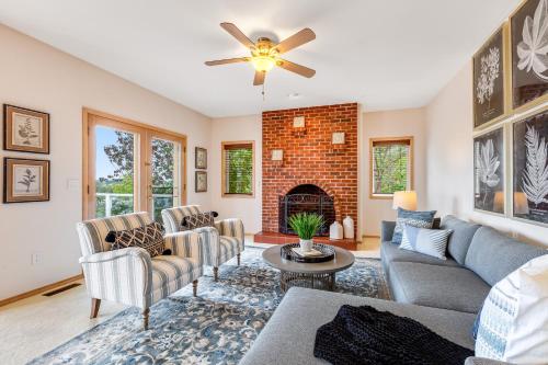a living room with a couch and a fireplace at Arrowhead Way in Utsalady