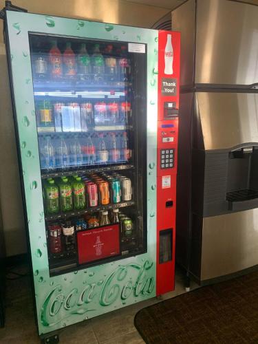 a vending machine filled with bottles of soda at Quality Inn Columbia Mall in Grand Forks