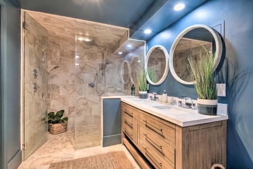 a bathroom with a shower and a sink with two mirrors at Pet-Friendly Home in Heart of Wine Country! in Linden