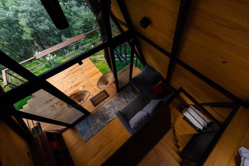 an overhead view of a living room in a log cabin at Woodland Cabins in Santa Ana Jilotzingo