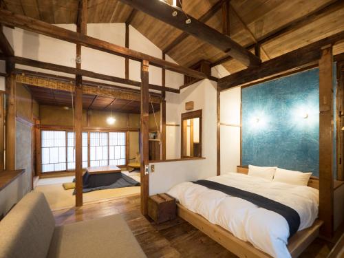 Postel nebo postele na pokoji v ubytování TOKYO LITTLE HOUSE