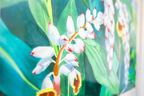 a bunch of white flowers on a wall at Garden Villa Hotel in Tumon
