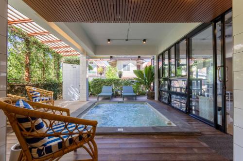 a swimming pool in the middle of a house at @Aonang Guesthouse in Ao Nang Beach