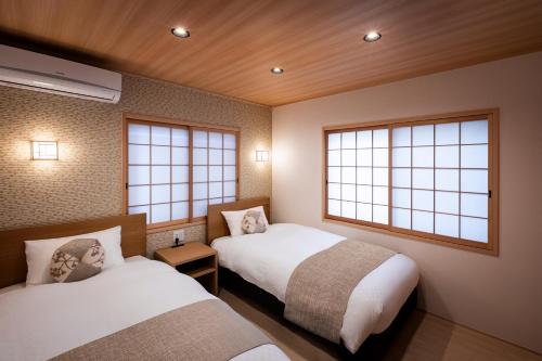 Un ou plusieurs lits dans un hébergement de l'établissement Rinn Tsukinowa West