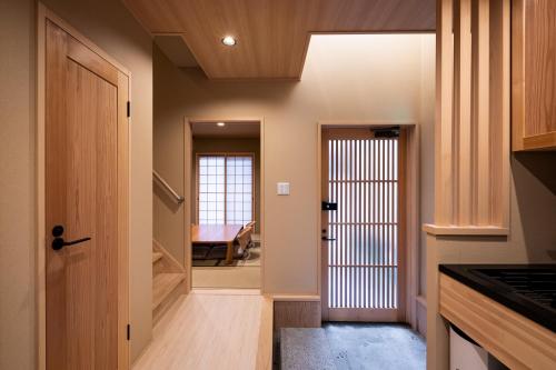 a hallway with a door leading to a bedroom at Rinn Tsukinowa West in Kyoto