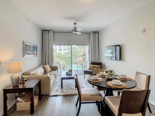 a living room with a table and a couch at Pet Friendly in Orlando area near Disney in Orlando