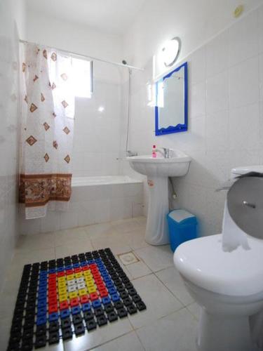 a bathroom with a toilet and a sink at Islambek Hotel & Travel in Khiva
