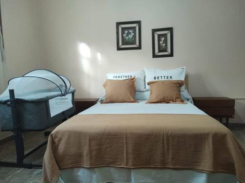 a hospital room with a bed with two pillows at Quinta - Casa de Campo in Merlo