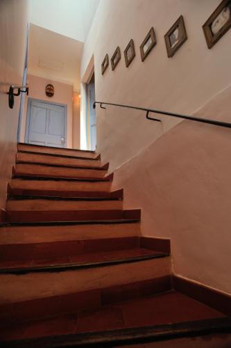 a set of stairs in an old building with paintings on the wall at Gîtes Domaine des Machottes in Grans