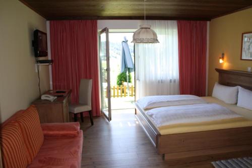 A bed or beds in a room at Sportpension Ramlhof