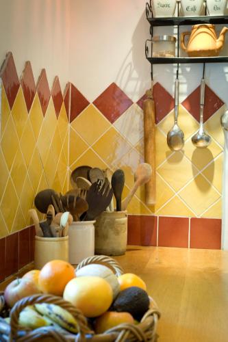a bunch of utensils in a basket on a table at Gîtes Domaine des Machottes in Grans