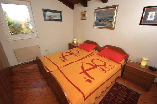 a bedroom with two beds with writing on them at Family friendly seaside apartments Novigrad - 7118 in Novigrad Istria