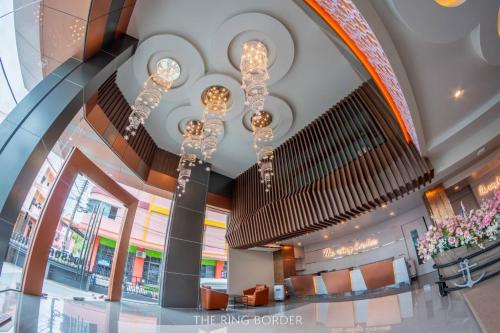 a lobby of a building with a chandelier at The Ring Border in Ban Khlong Phruan