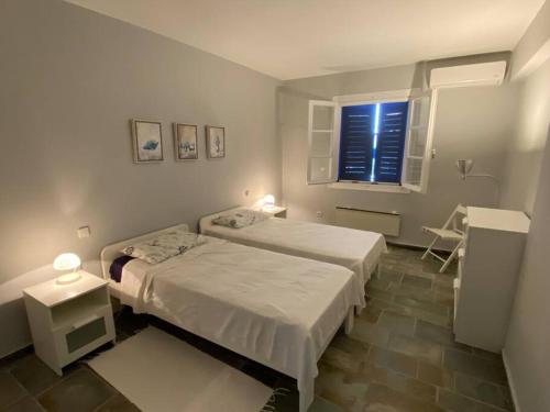 Ένα ή περισσότερα κρεβάτια σε δωμάτιο στο RETREAT VILLA BY THE SEA WITH POOL IN PORTO HELI