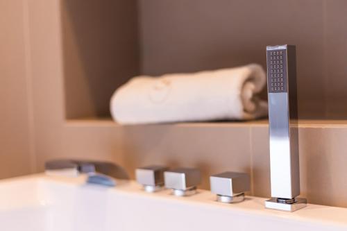 a remote control sitting on top of a counter at Solmaris Tropea Rooms & Suites in Tropea