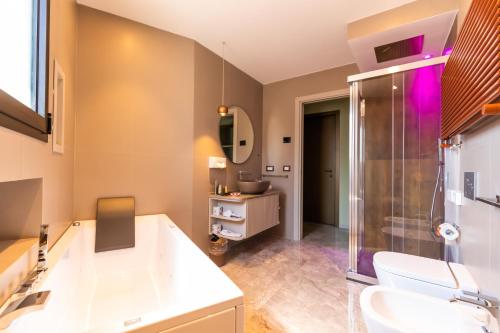 a bathroom with a shower and a sink at Solmaris Tropea Rooms & Suites in Tropea