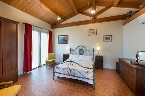 Кровать или кровати в номере Agriturismo Podere l'Aione